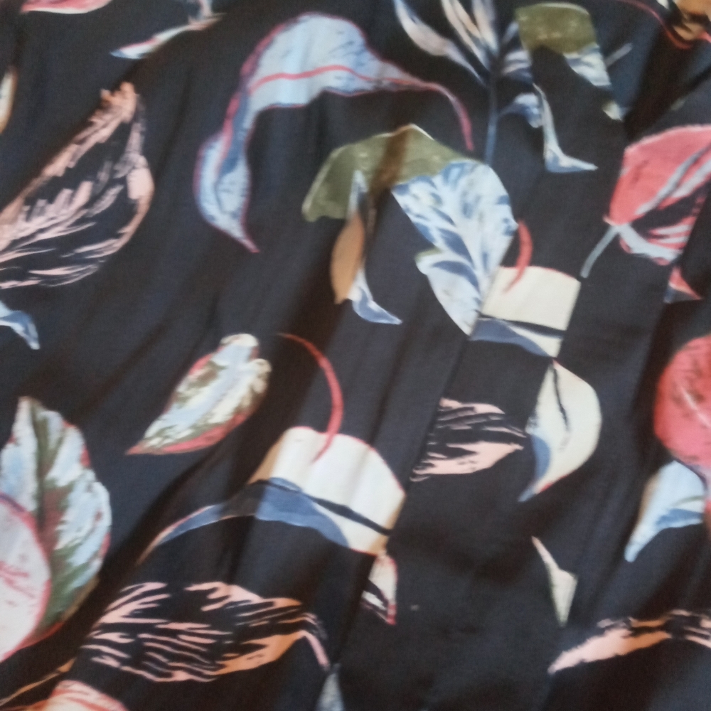 A blue shirt with leaves